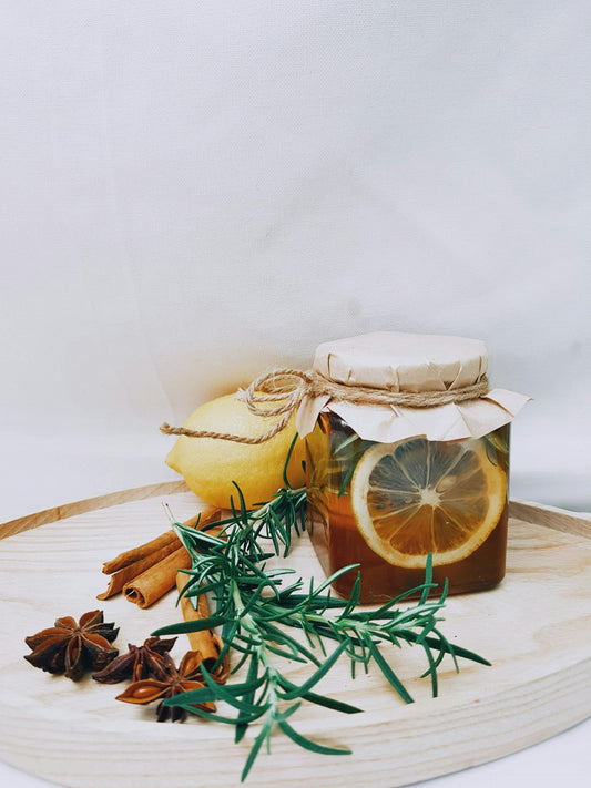 orange cinnamon lemon thyme on a wooden plate